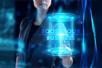 Business, Technology, Internet and network concept. Young businessman working on a virtual screen of the future and sees the inscription: Boost your business