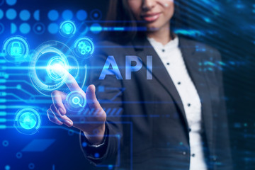 Fototapeta premium Business, Technology, Internet and network concept. Young businessman working on a virtual screen of the future and sees the inscription: API