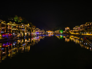 Fototapeta na wymiar fenghuang,Hunan/China-16 October 2018:Scenery view in the night of fenghuang old town .phoenix ancient town or Fenghuang County is a county of Hunan Province, China