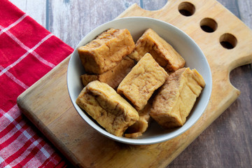 fried tofu on a wooden background  