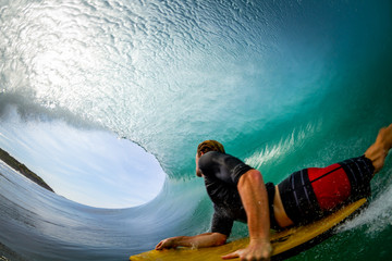 man riding inside a wave