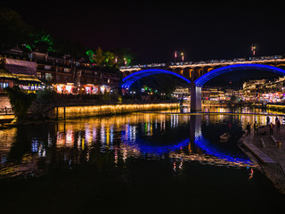 Fototapeta na wymiar fenghuang,Hunan/China-16 October 2018:Scenery view in the night of fenghuang old town .phoenix ancient town or Fenghuang County is a county of Hunan Province, China