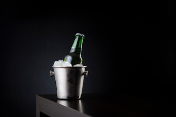 Bottle of beer in an ice bucket