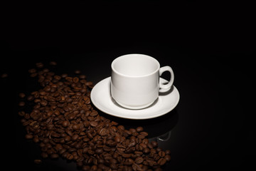 Cup with coffee beans on a dark background