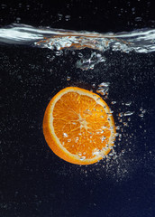 orange in water splash