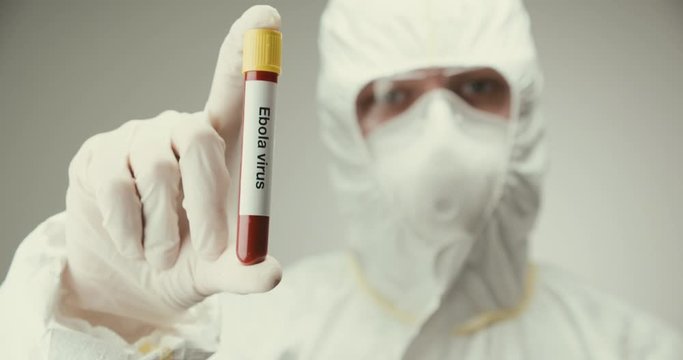 Scientist laboratory protection glasses test tube concept Ebola virus blood gray background