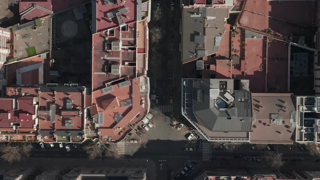 AERIAL: Barcelona Overhead Drone Shot of Typical City Blocks in Beautiful Sunlight with Urban Traffic 