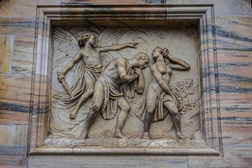 Architectural fragment of Milan Cathedral (Duomo di Milano, 1386), dedicated to St Mary of the Nativity (Santa Maria Nascente), with Gothic and Lombard Romanesque style. Milan, Italy.