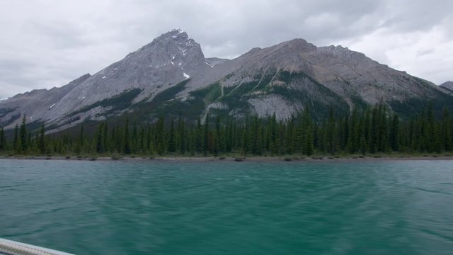 View from boat tour across Maligne Lake to see Spirit Island looking at Samson Peak