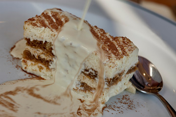 Image of tiramisu Italian dessert close up with cream