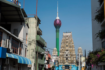 Hindu temple and skyscraper in urban city Sri Lanka