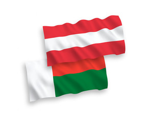 Flags of Austria and Madagascar on a white background