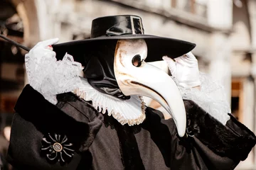 Foto op Canvas Person wearing costume and mask of a medieval doctor © Gioia
