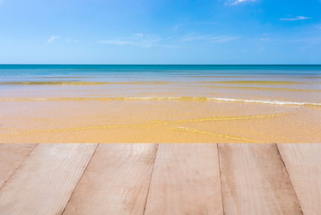 Fototapeta premium Wood table top on the sea with blue sky background