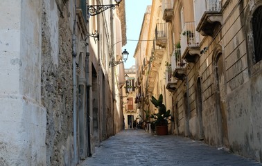 Ortigia Island, Sicily. Early in the morning, walking between the narrow streets, that are still in calm