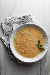 Delicious warm soup with chickpeas and rice. Typical spanish food, andalusian puchero.