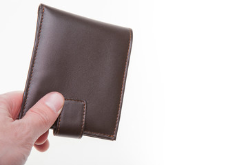 Man hand holding brown wallet isolated on white background