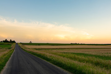 Fototapeta na wymiar sunset over the open road.