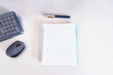 Opent  notebook with pen, computer mouse and keyboard on the table for education on line or work at distance concept.