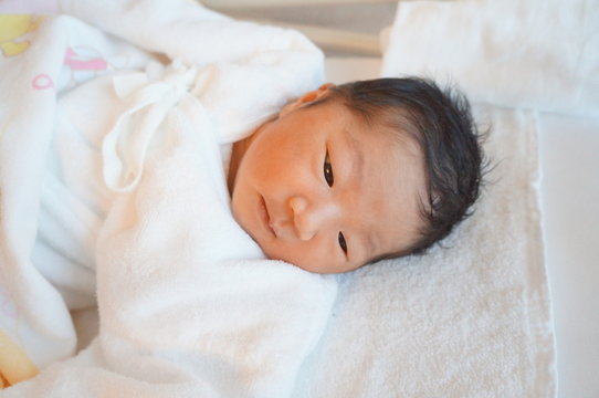 It is a photograph of a newborn baby.
