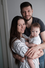 Fototapeta na wymiar Family portrait: mother, father and newborn baby..