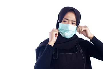 Muslim woman wearing black scarf and medical mask, muslim girl wearing mask for viral infection