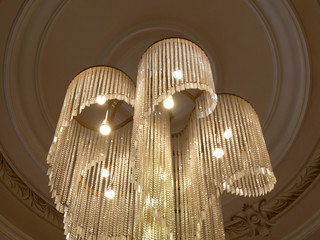 Chrystal chandelier lamp on the ceiling in Palace. Adjusting the image in a Luxury tone .Decorative...