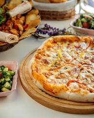 mixed pizza on the table