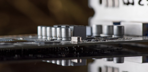 A fragment of the electronic board of the video card. Photographed close-up.