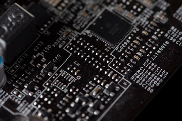 A fragment of the electronic board of the video card. Photographed close-up.