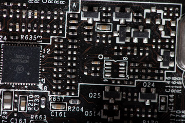 A fragment of the electronic board of the video card. Photographed close-up.
