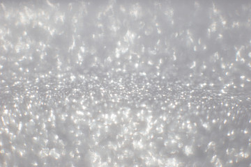 white and silver abstract bokeh lights. defocused background
