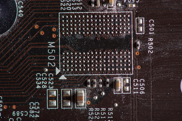 A fragment of the electronic board of the video card. Photographed close-up.