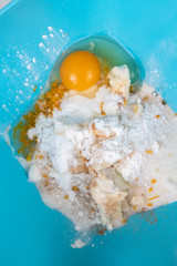 White sugar with cocoa and raw egg mixture for cookies.