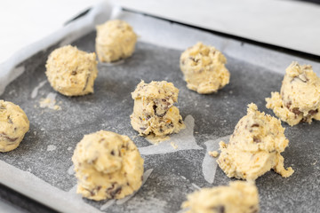 Raw crisp cookies prepared for baking on baking tray