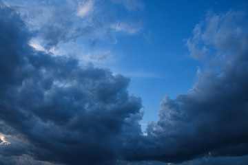 Stormy sky with storm clouns on the sunset with beautiful sun