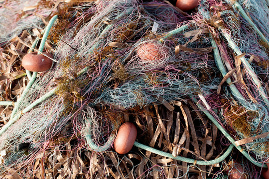 Close view of some fishing net floaters, boat fishing nets.
