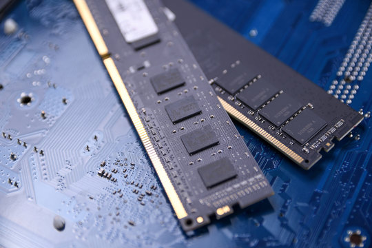 Computer memory RAM on motherboard background . Close up. system, main memory, random access memory, onboard, computer detail. Computer components . DDR3. DDR4. DDR5