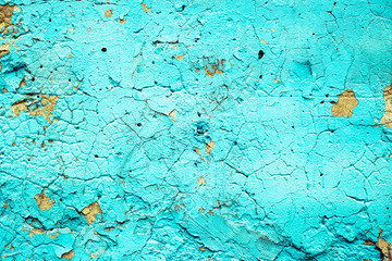 Concrete gray wall with peeling blue paint texture or background. High contrast and resolution image with place for text. Template for design