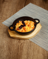 omelette in black pan with basil
