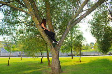 young woman doing yoga exercises in the park