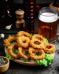 onion rings with glass of beer