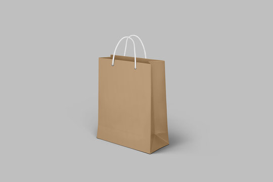 Brown paper bag mockup isolated on grey background.