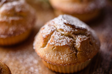 Fresh baked cupcakes of rice flour with banana and vanilla with a mug of hot chocolate