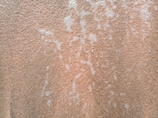 Mor wave on the coastal sand, the background texture of the sea wave and foam on the sand.