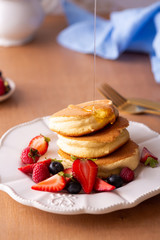 Trendy homemade japanese pancakes for breakfast with berries