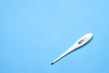 Medical thermometer on a blue background.