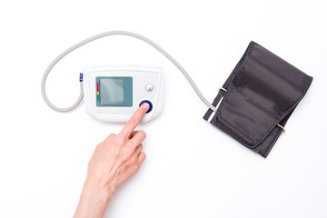 Electronic tonometer on the hand isolated on white