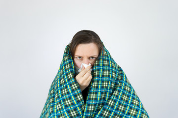 Unhealthy woman wearing medical mask, blowing nose into tissue. have flu, virus. corona virus covid-19 concept