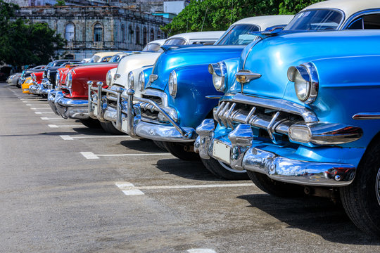 Colorful Group Of Parked Classic Cars In Old Havana, An Iconic Sight In Cuba